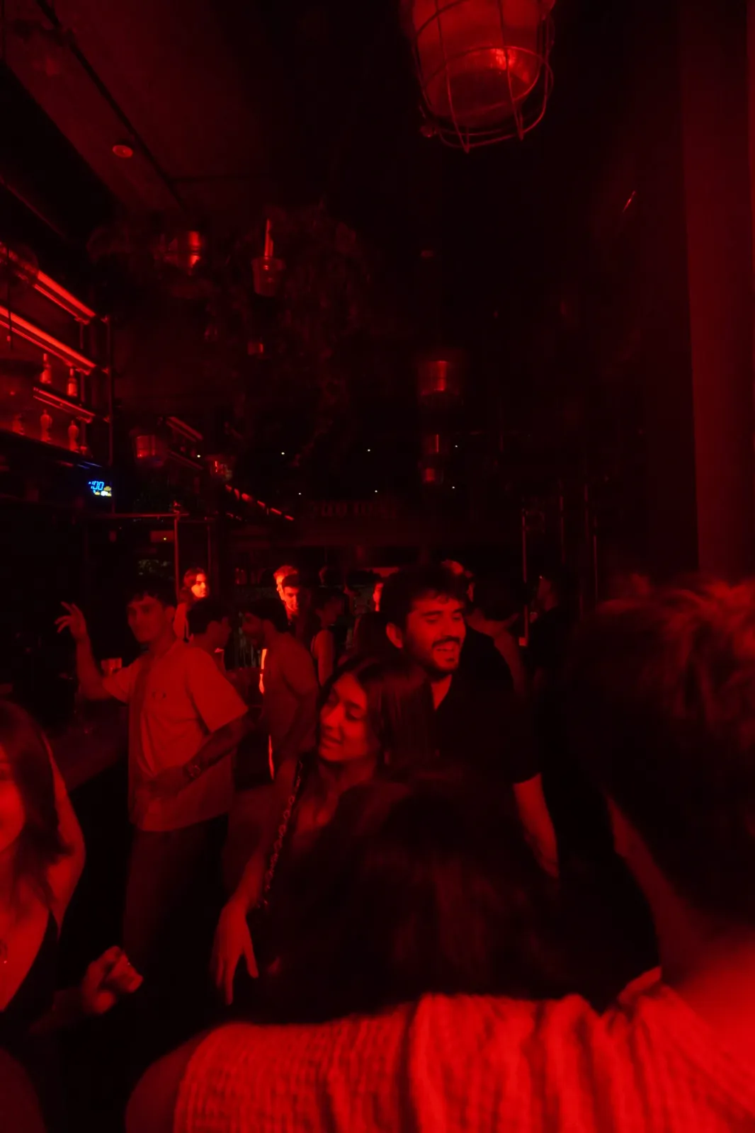 Crowd dancing and talking in the venue