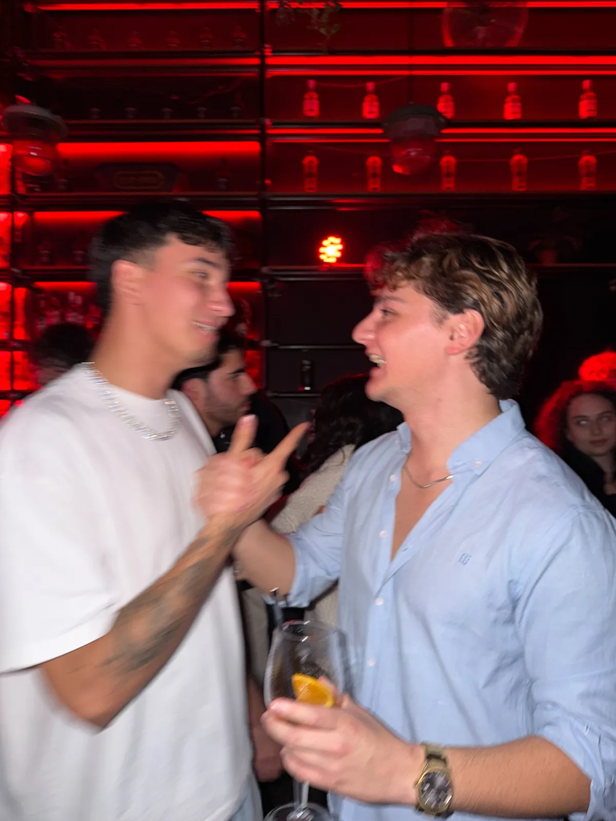 Two guests greeting each other on the dancefloor